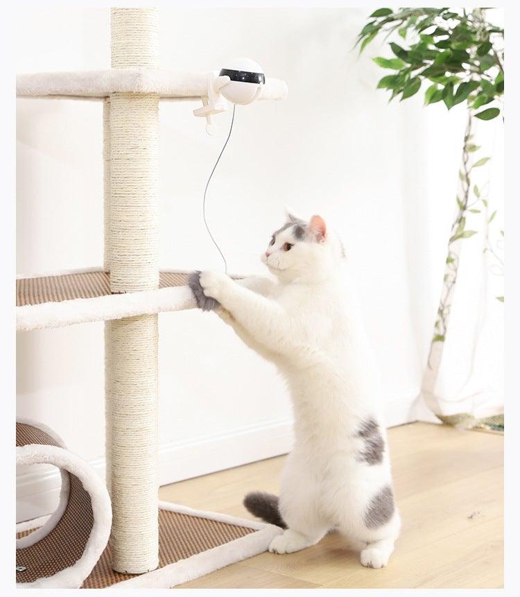 Automatic cat teaser toy with white base and dangling gray plush wand for cats