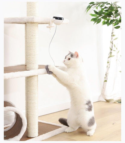 Automatic cat teaser toy with white base and dangling gray plush wand for cats