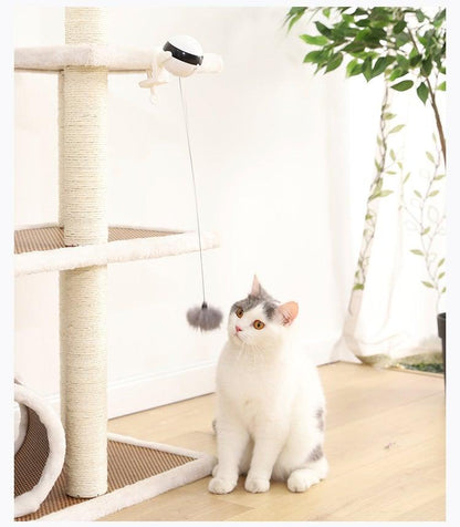 Automatic cat teaser toy with hanging gray plush ball above cat scratch post
