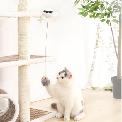 Automatic cat teaser toy with white unit and hanging gray plush wand