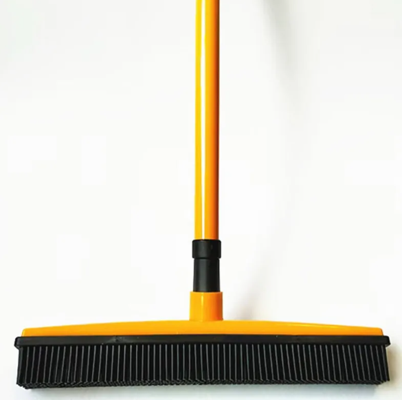 Pet hair removal broom mop with yellow handle, orange base, and black bristle head