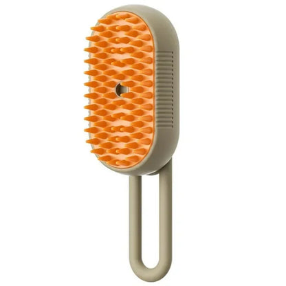 Cat steam brush with orange massage head and beige handle, angled view