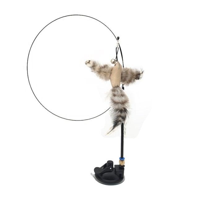 Cat teaser wand with gray plush feather bird toy on string and black stand base
