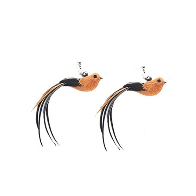 Two orange bird cat toy attachments with black feather tails