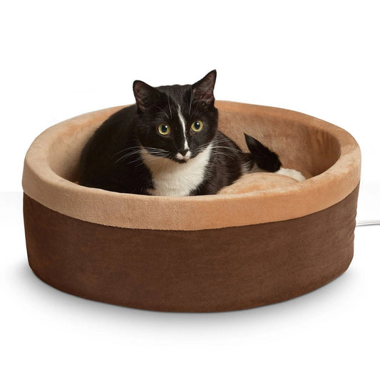 Mocha round heated cat bed with tan cushioned interior and dark outer cover