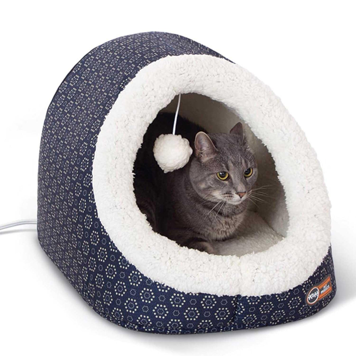 Grey cat resting inside a Jeffers Thermo-Pet Cave heated cat bed with a white plush interior.