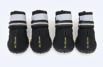Black dog waterproof booties with white top bands and hook-and-loop straps