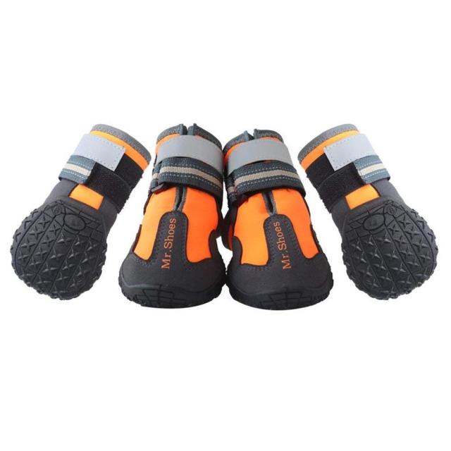 Four dog waterproof booties in orange and black with gray strap cuffs