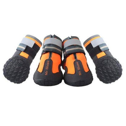 Four dog waterproof booties in orange and black with gray strap cuffs