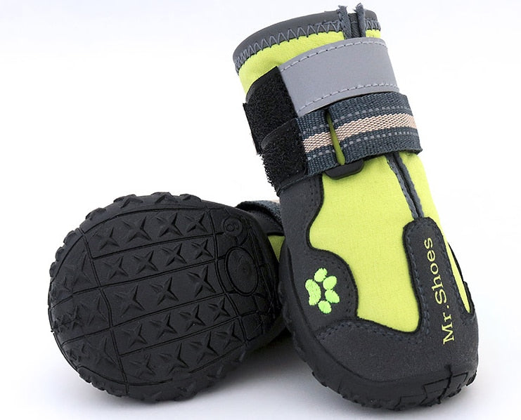 Waterproof dog boots, lime green and black with paw-print logo and grippy sole