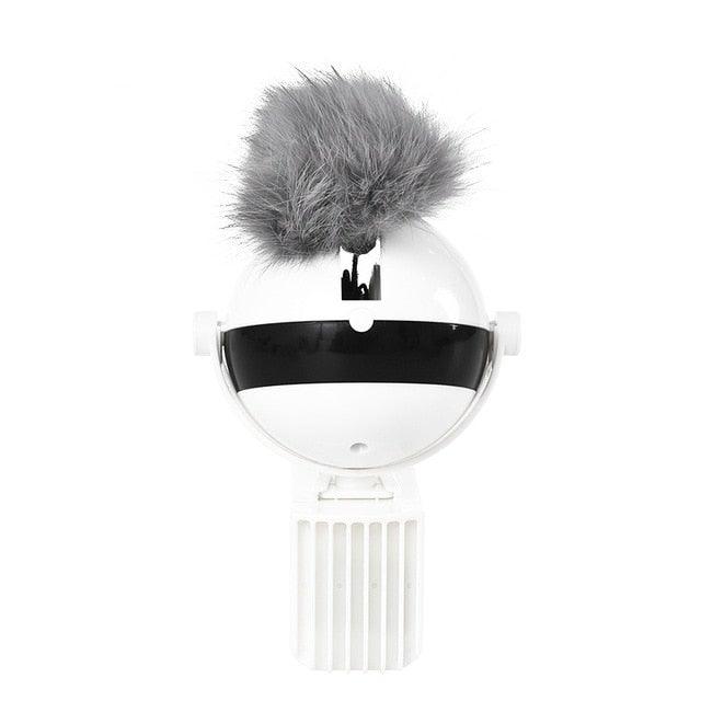 Automatic cat teaser toy with white base, black dome, and gray plush ball